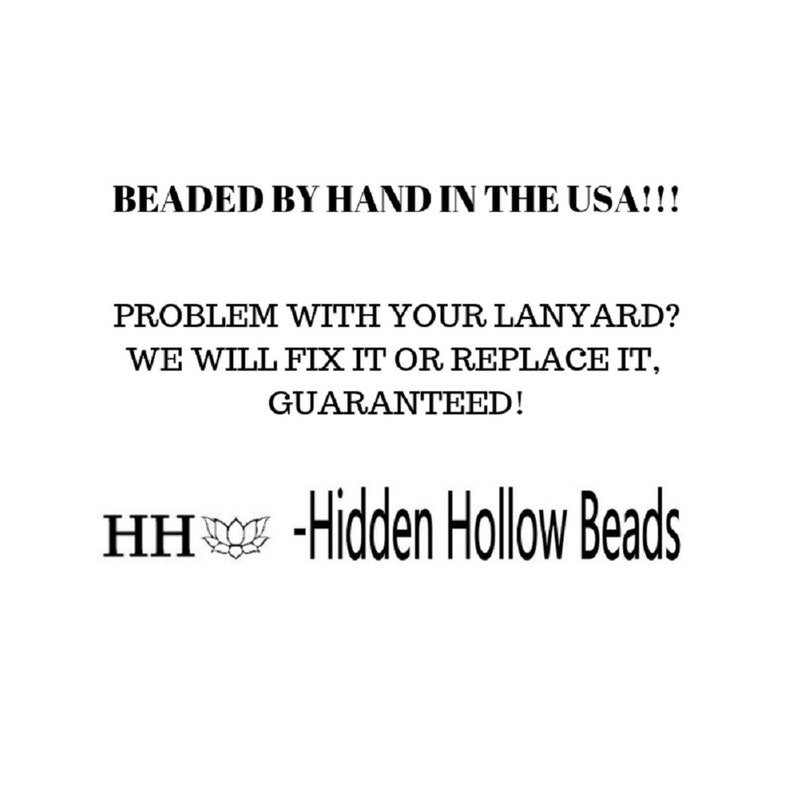 May include: Black and white text on a white background. The text reads "BEADED BY HAND IN THE USA!!! PROBLEM WITH YOUR LANYARD? WE WILL FIX IT OR REPLACE IT, GUARANTEED! HH -Hidden Hollow Beads"