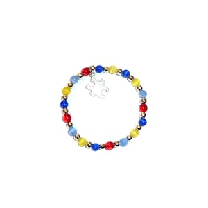 Autism Awareness Packaged Bracelet, with puzzle charm. Stretch Cord.  Will fit most adults.
