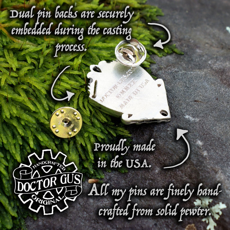 May include: A silver-coloured pin with dual pin backs, proudly made in the USA. The pin is finely hand-crafted from solid pewter. The text on the pin reads "DOCTOR GUS ORIGINAL" and "MADE IN USA".