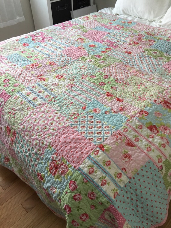 light blue and white quilt