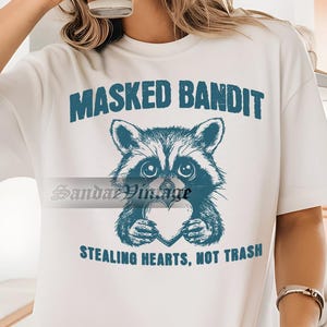 Masked Bandit Stealing Hearts Not Trash Shirt, Funny Raccoon Shirt, Raccoon Meme Shirt, Raccoon Lover Shirt, Gift For Women and Man Unisex