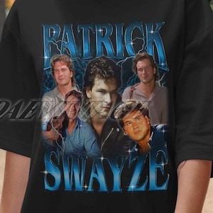 May include: Black t-shirt with a blue and white graphic of Patrick Swayze. The graphic features multiple images of Patrick Swayze from different movies. The text "Patrick Swayze" is written in a blue and white font.
