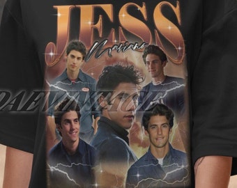May include: Black t-shirt with a vintage-style graphic of Jess Mariano from the TV show Gilmore Girls. The graphic features multiple images of Jess Mariano and the text "Jess Mariano" in gold letters.