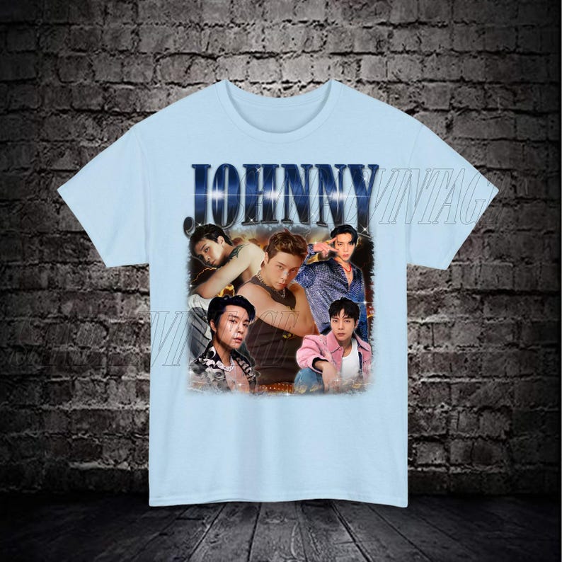May include: Light blue t-shirt with a vintage-style graphic featuring a group of men with the word "JOHNNY" printed in bold letters.