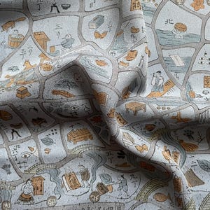 May include: A light grey fabric featuring a repeating pattern of illustrated scenes and Japanese characters. The illustrations are in shades of orange and grey, depicting people, buildings, and objects. The fabric is draped, showing its texture and design.