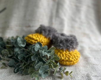 Crochet baby booties with faux fur trim