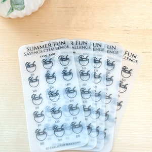May include: A set of five transparent sheets with a summer savings challenge theme. Each sheet features a grid of 25 coconut drink icons with dollar amounts ranging from $5 to $35. The sheets are labeled "Summer Fun Savings Challenge" and "Goal: $300".