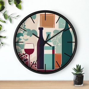May include: A black clock with a white background and a design of wine bottles, grapes, and a glass of wine. The clock face has black hands and black numbers.