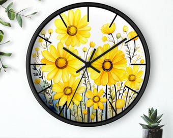 May include: A black framed wall clock with a white background and a watercolor design of yellow daisies.