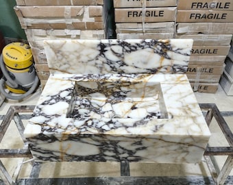 Lavabo de pared de mármol Calacatta con protector contra salpicaduras