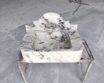 Lavandino a parete in marmo Calacatta con paraschizzi