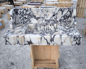 Lavandino in marmo Calacatta Viola: lavabo da parete intagliato a mano