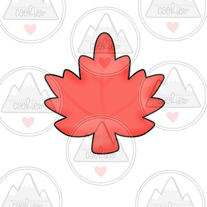 May include: A red maple leaf cookie cutter. The cutter is shaped like a maple leaf with a pointed tip and rounded edges.