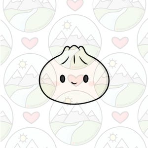 May include: A white dumpling-shaped cookie cutter with a black outline, featuring a cartoon face with two black oval eyes, a small smile, and pink cheeks. The top of the dumpling has a pleated design, and the overall shape is rounded.