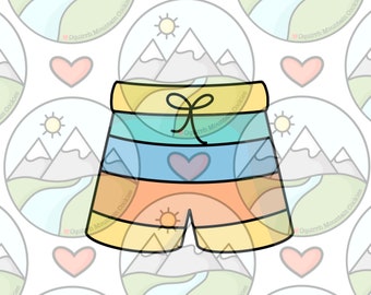 May include: A colorful cookie cutter shaped like a pair of shorts with a yellow waistband, blue, orange, and yellow stripes, and a small heart on the front.