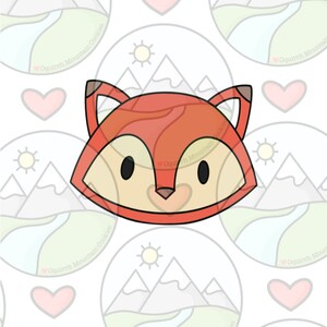 May include: A red fox cookie cutter with a simple design. The cutter has a rounded head with two large eyes, a small nose, and two pointy ears.