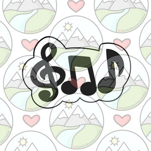 May include: A black and white cookie cutter in the shape of a treble clef and two musical notes. The cookie cutter is on a white background with a repeating pattern of mountains, hearts, and suns.
