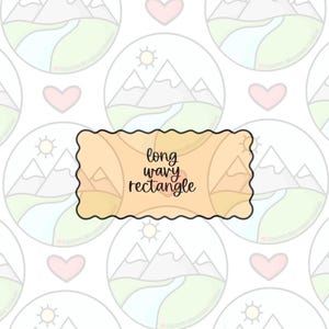 May include: A light orange long wavy rectangle with black trim and the words "long wavy rectangle" in black. The background is a pattern of mountain and sun illustrations in a circle, with hearts.