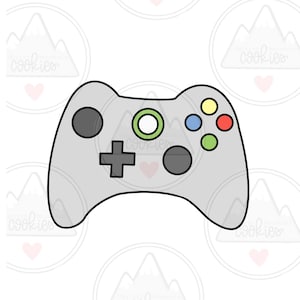 May include: A gray video game controller with black buttons and a green, blue, yellow, and red button. The controller has a black plus sign and a black circle button.
