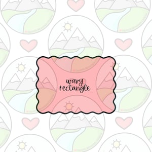 Puede incluir: Un cortador de galletas rosa con forma de rectángulo ondulado. El texto "wavy rectangle" está en el centro. El fondo es un patrón repetitivo de ilustraciones de montañas y sol, con corazones.