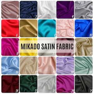 May include: A collection of 25 fabric swatches in various colors, including red, blue, green, yellow, and white. The fabric is a Mikado satin, which is a type of silk fabric known for its smooth, lustrous finish. The swatches are arranged in a grid pattern, with each swatch labeled with a number from 1 to 25. The text "MIKADO SATIN FABRIC" is displayed in the center of the image.
