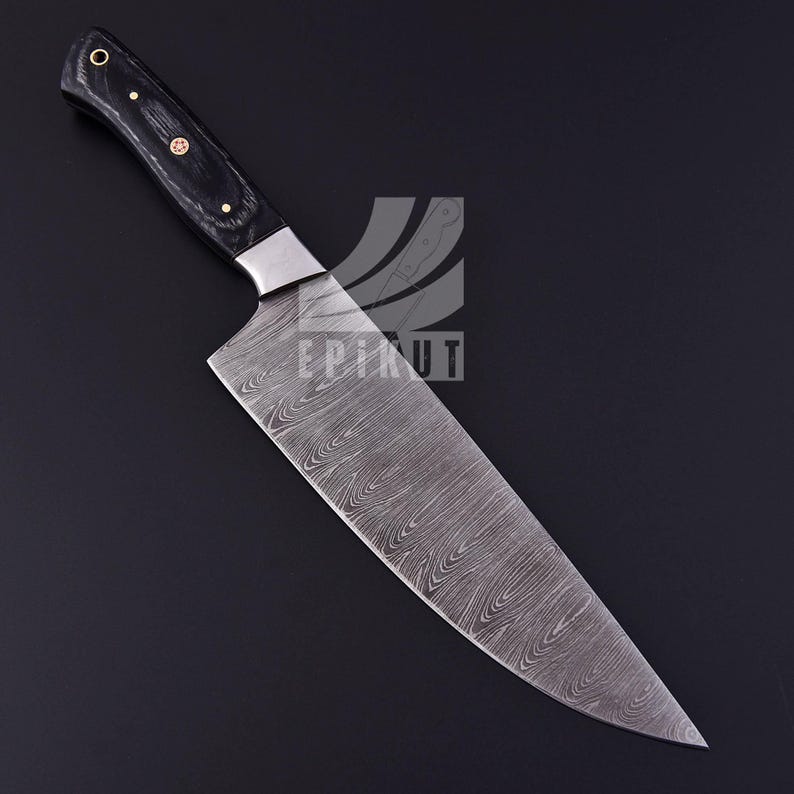 May include: A black handled chef's knife with a Damascus steel blade. The blade has a wavy pattern and a pointed tip.