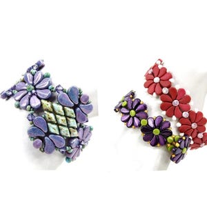 May include: Two beaded bracelets with floral designs. One bracelet is purple and green, the other is red and white.