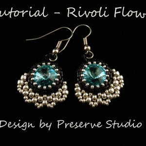 May include: A pair of handmade earrings with a Rivoli flower design. Each earring features a large, round, light blue crystal surrounded by black beads and silver-colored seed beads. The text "Tutorial - Rivoli Flower" and "Design by Preserve Studio" are visible.