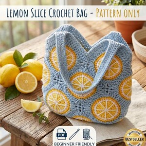 May include: A light blue crochet bag with yellow and white lemon slice designs. The bag has two handles and is sitting on a wooden table next to fresh lemons. Text on the image reads "LEMON SLICE CROCHET BAG - PATTERN ONLY" and "BEGINNER FRIENDLY".