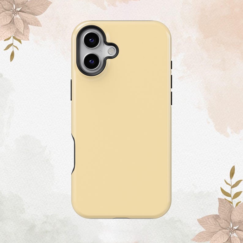 May include: A cream-colored phone case with a black camera cutout and a black border.