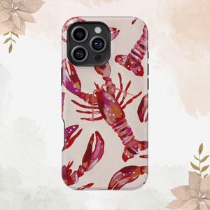 May include: A phone case with a pink and red lobster pattern. The case has a black camera cutout and a white background.