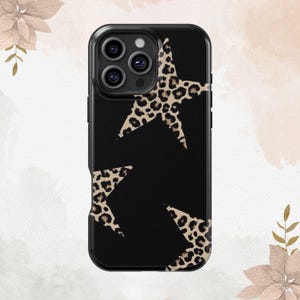 May include: Black phone case with a leopard print star design.