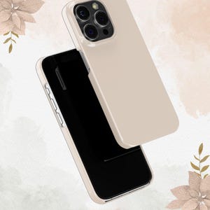 May include: A beige phone case for an iPhone with a black screen and a camera bump on the back.
