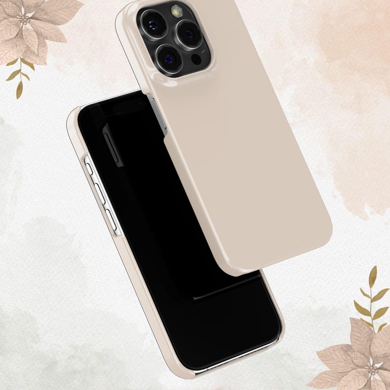 May include: A beige phone case for an iPhone with a black screen and a camera bump on the back.