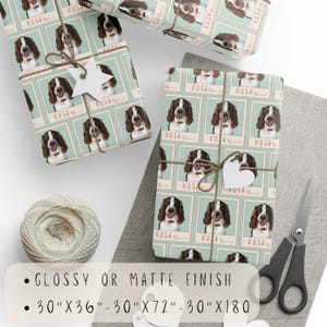 May include: Gift wrap featuring a repeated pattern of a brown and white dog with the name "ROSA" printed in a vintage style font. The wrapping paper is available in glossy or matte finish and in three sizes: 30 inches by 36 inches, 30 inches by 72 inches, and 30 inches by 180 inches.