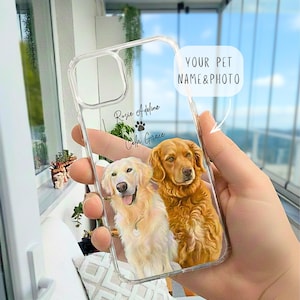 May include: Clear phone case featuring a custom design with two golden retriever dogs. The case includes the text "YOUR PET NAME & PHOTO", along with the names "Rosie Adeline" and "Cath Grace".