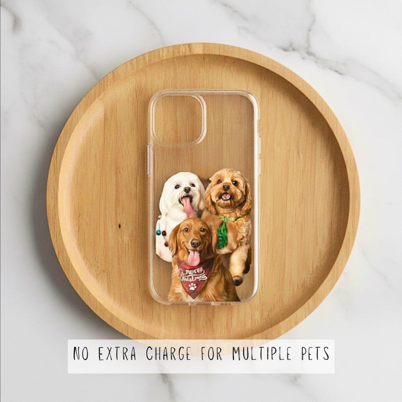 May include: Clear phone case featuring a custom design of three dogs. The dogs are a white dog with its tongue out, a brown dog with a green bow, and a golden retriever wearing a Christmas bandana. The case is on a wooden tray.