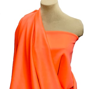 Spandex high performance tricot ..matte finish.. 4 ways stretch.. MANGO CITRUS.. uses leotards, gymnastics, pageant, dance, shorts