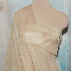 English Netting fabric.. 54 wide   100% poly...NUDE . sold by the yard.. wedding dress, formal wear, home decor