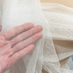 English Netting fabric.. 54 wide   100% poly. WHITE . sold by the yard.. wedding dress, formal wear, home decor