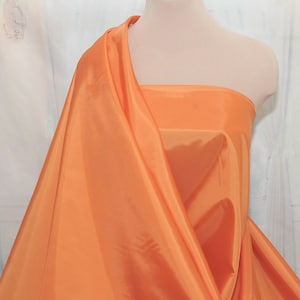 Poly Lining fabric 58 inches wide..Tangerine  .. . used for lining  jackets, skirts, dresses. vests, soft, light weight