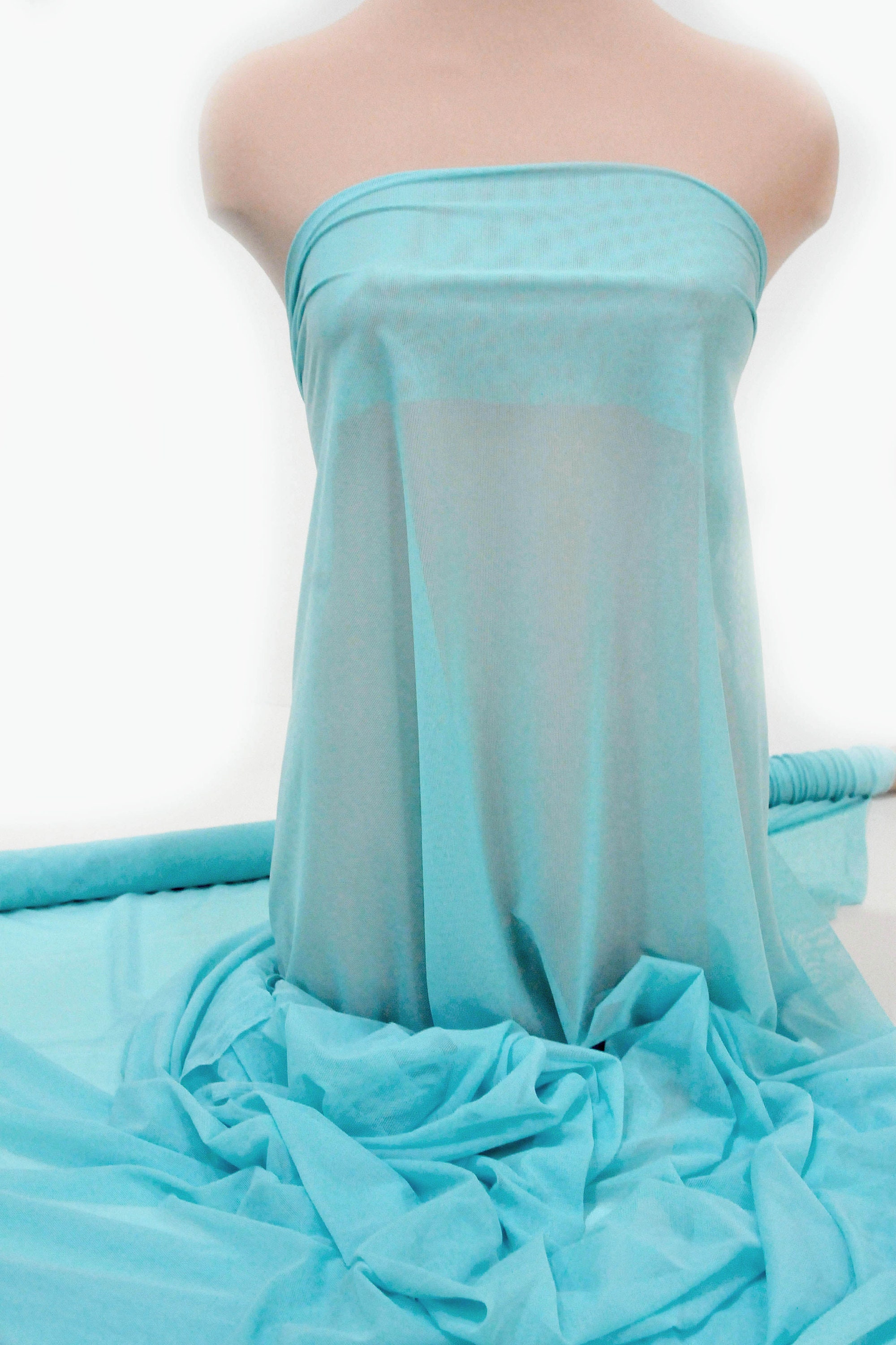 Power mesh stretch fabric, semi sheer, 4 ways stretch.. Aqua or Aquamarine     . 58 " wide.. dance, pageant, formal, costume,