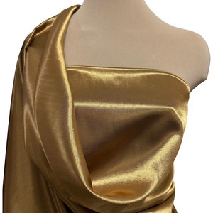 Reversible satin faille BURNT GOLD/BLACK  fabric. . Bridesmaids, formal wear, pageant wear, home decor crafts