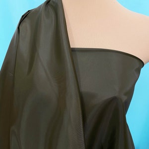 Poly Lining fabric 48 inches wide.. Willow green .. used for lining  jackets, skirts, dresses. vests, soft, light weight