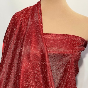 Lurex foam RED  .. 100% poly backing.. stretch ... light weight, glittered in red .. holiday wear, formal , prom .. suits..
