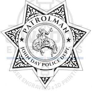 May include: Black and white John Day Police Dept. patrolman badge. The badge is star-shaped with ornate filigree around the edges. A central circle features a rider on a bucking horse, with the words "PATROLMAN" and "JOHN DAY POLICE DEPT."