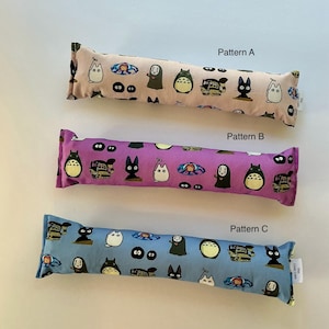 May include: Three rectangular cat toys with different patterns. Pattern A is light pink, Pattern B is purple, and Pattern C is light blue. Each toy is decorated with cartoon characters and the text "Pattern A", "Pattern B", and "Pattern C".