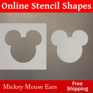 May include: Two white Mickey Mouse ear stencils on a gray background. The text "Online Stencil Shapes" is at the top of the image in red letters. The text "Mickey Mouse Ears" is at the bottom left of the image in red letters. The text "Free Shipping" is at the bottom right of the image in red letters.