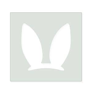 May include: A square stencil featuring a white cutout of two long, upright rabbit ears centered on a light gray background. The design is symmetrical, with the ears tapering to rounded points at the top and widening at the base.