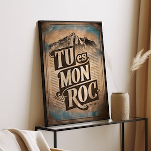 Peut inclure: Une affiche de style vintage avec une scène de montagne et le texte "TU es MON ROC PS 183" dans une police d'écriture brune et noire vieillie.